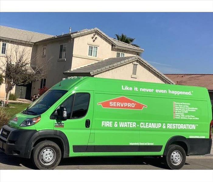 SERVPRO vehicle parked in front of house